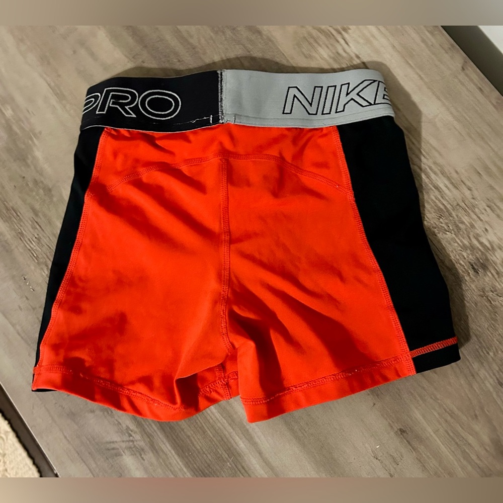 Nike Pro Dri-FIT Orange Girl’s Athletic Shorts - Picture 2 of 3